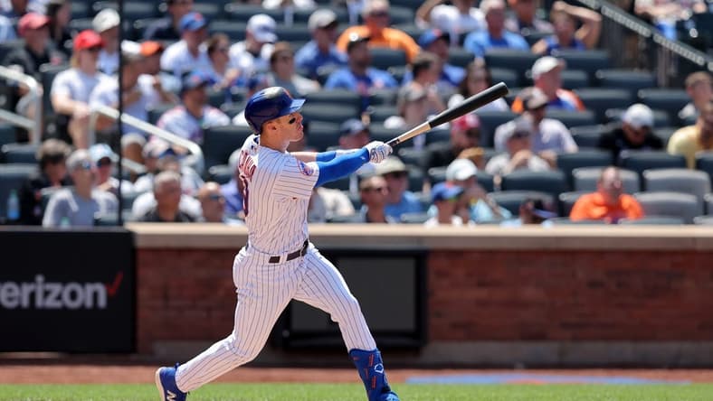 Jun 1, 2023; New York City, New York, USA; New York Mets left fielder Mark Canha (19) follows through on a two run home run against the Philadelphia Phillies during the fourth inning at Citi Field. Mandatory Credit: Brad Penner-USA TODAY Sports