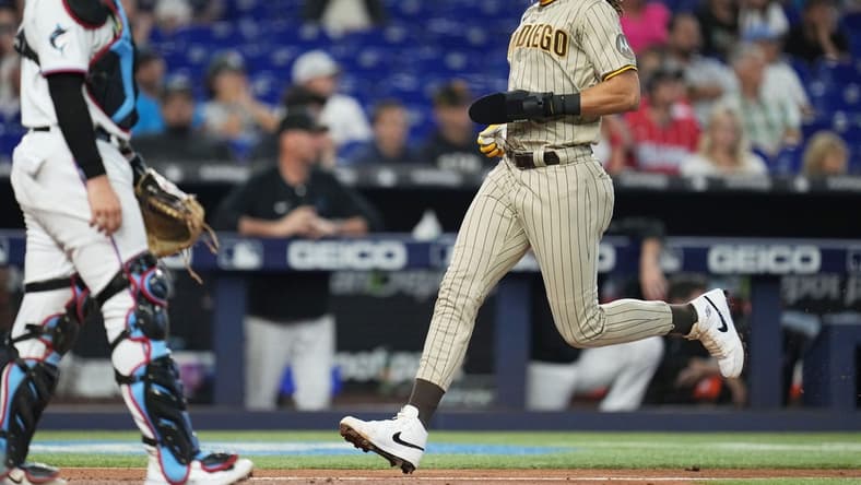 Jun 1, 2023; Miami, Florida, USA; San Diego Padres right fielder Fernando Tatis Jr. (23) scores a run in the fourth inning against the Miami Marlins at loanDepot Park. Mandatory Credit: Jim Rassol-USA TODAY Sports