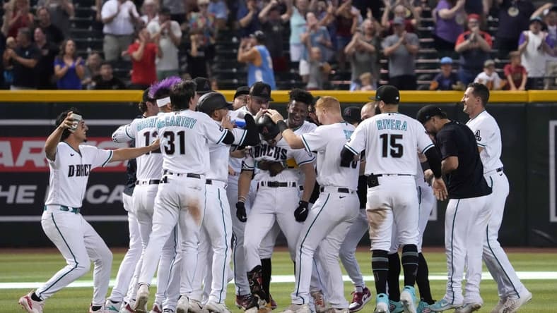 Jun 1, 2023; Phoenix, Arizona, USA; Arizona Diamondbacks left fielder Corbin Carroll (7) celebrates his walk off two RBI single against the Colorado Rockies during the ninth inning at Chase Field. Mandatory Credit: Joe Camporeale-USA TODAY Sports