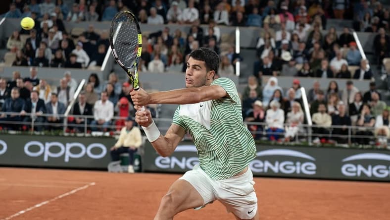 Jun 2, 2023; Paris,France; Carlos Alcaraz (ESP) returns a shot during his match against Denis Shapovalov (CAN) on day six at Stade Roland-Garros. Mandatory Credit: Susan Mullane-USA TODAY Sports