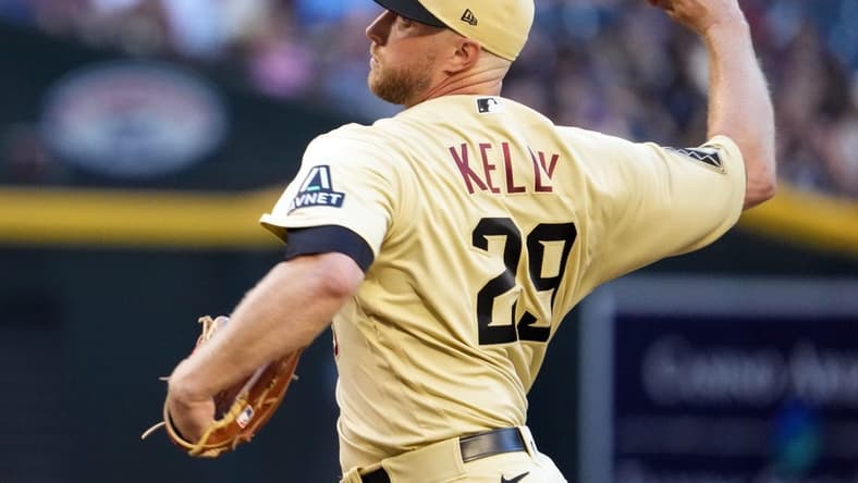 Jun 2, 2023; Phoenix, Arizona, USA; Arizona Diamondbacks starting pitcher Merrill Kelly (29) pitches against the Atlanta Braves during the first inning at Chase Field. Mandatory Credit: Joe Camporeale-USA TODAY Sports
