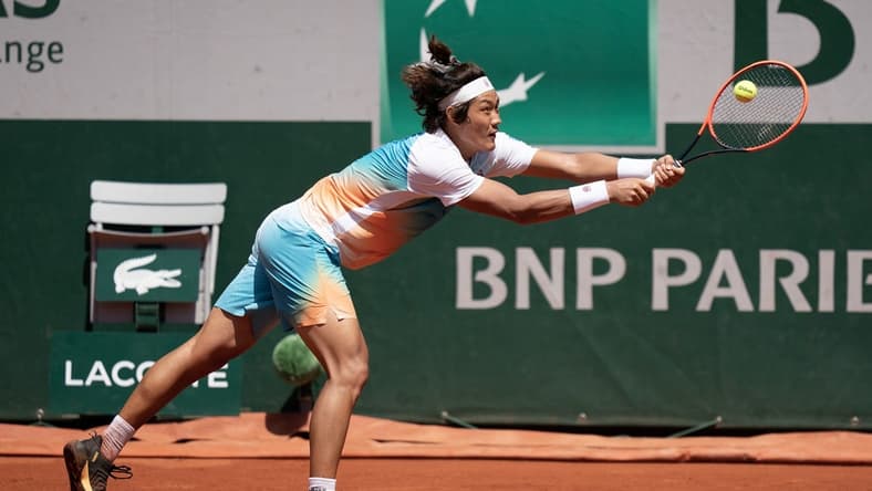 Jun 3, 2023; Paris,France; Zhizhen Zhang (CHN) returns a shot during his match against Casper Ruud (NOR) on day seven at Stade Roland-Garros. Mandatory Credit: Susan Mullane-USA TODAY Sports