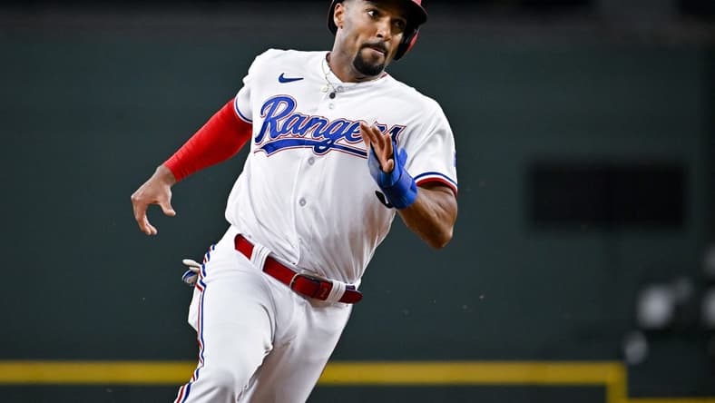 Jun 3, 2023; Arlington, Texas, USA; Texas Rangers second baseman Marcus Semien (2) scores against the Seattle Mariners during the second inning at Globe Life Field. Mandatory Credit: Jerome Miron-USA TODAY Sports