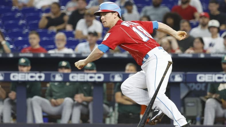 Jun 3, 2023; Miami, Florida, USA; Miami Marlins shortstop Joey Wendle (18) doubles against the Oakland Athletics during the second inning at loanDepot Park. Mandatory Credit: Rhona Wise-USA TODAY Sports