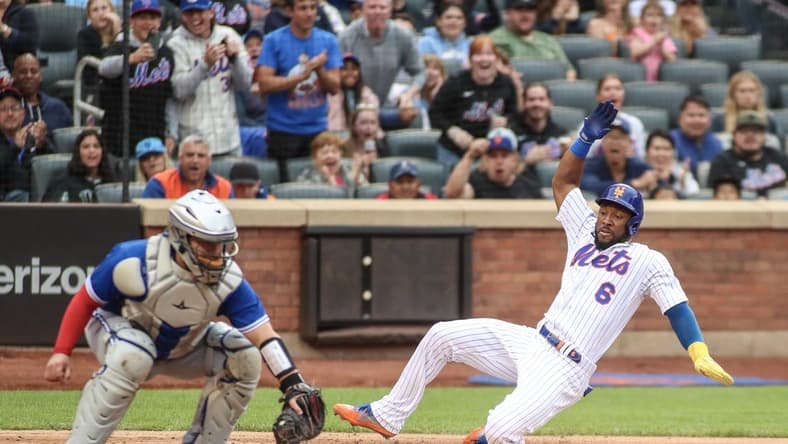 Jun 3, 2023; New York City, New York, USA; New York Mets right fielder Starling Marte (6) slides into home to score in the second inning against the Toronto Blue Jays at Citi Field. Mandatory Credit: Wendell Cruz-USA TODAY Sports