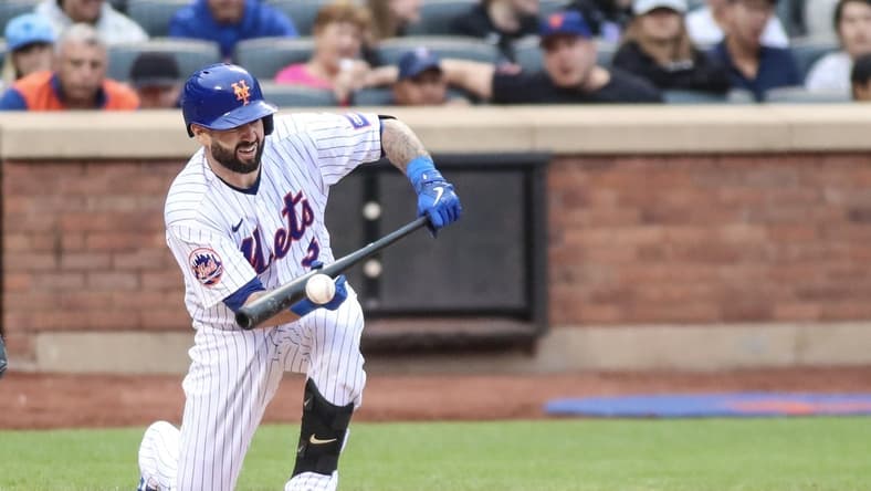 Jun 3, 2023; New York City, New York, USA; New York Mets catcher Tomas Nido (3) attempts a sacrifice bunt in the fifth inning against the Toronto Blue Jays at Citi Field. Mandatory Credit: Wendell Cruz-USA TODAY Sports
