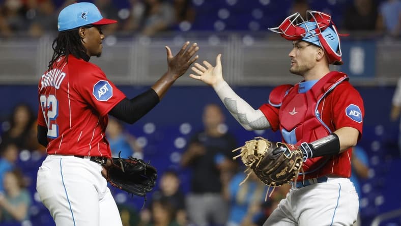 Jun 3, 2023; Miami, Florida, USA; Miami Marlins relief pitcher George Soriano (62) and catcher Nick Fortes (4) celebrate against the Oakland Athletics following the game at loanDepot Park. Mandatory Credit: Rhona Wise-USA TODAY Sports