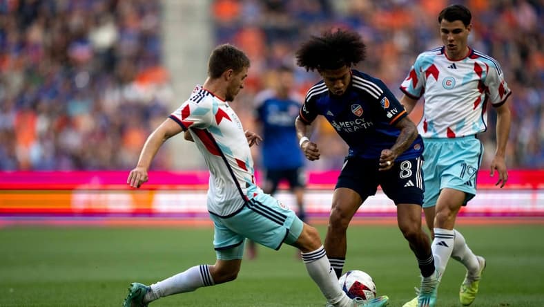 Chicago Fire forward Georgios Koutsias (19) kicks the ball away from FC Cincinnati midfielder Marco Angulo (8) in the first half of the MLS match at TQL Stadium in Cincinnati on Saturday, June 3, 2023.
