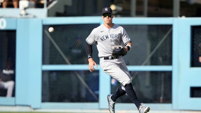 Jun 3, 2023; Los Angeles, California, USA; New York Yankees right fielder Aaron Judge (99) fields the ball on a single by Los Angeles Dodgers catcher Will Smith (not pictured) in the fourth inning at Dodger Stadium. Mandatory Credit: Kirby Lee-USA TODAY Sports