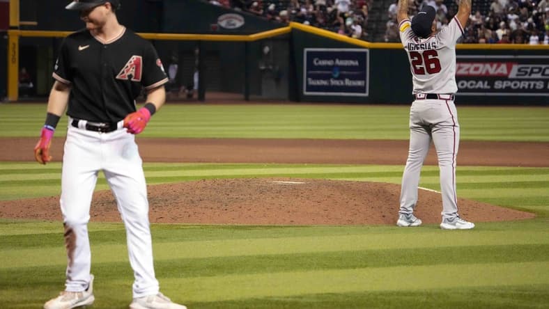 Jun 3, 2023; Phoenix, Arizona, USA; Atlanta Braves relief pitcher Raisel Iglesias (26) celebrates after retiring Arizona Diamondbacks designated hitter Pavin Smith (26) for the final out of the ninth inning at Chase Field. Mandatory Credit: Joe Camporeale-USA TODAY Sports