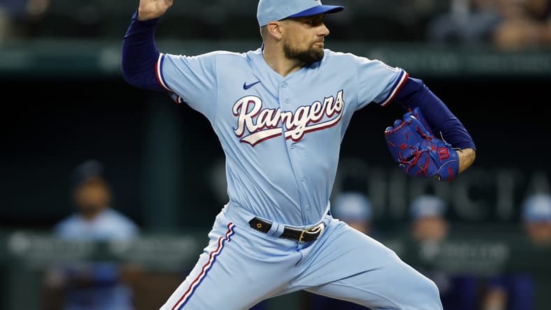 Jun 4, 2023; Arlington, Texas, USA; Texas Rangers starting pitcher Nathan Eovaldi (17) throws a pitch in the first inning against the Seattle Mariners at Globe Life Field. Mandatory Credit: Tim Heitman-USA TODAY Sports