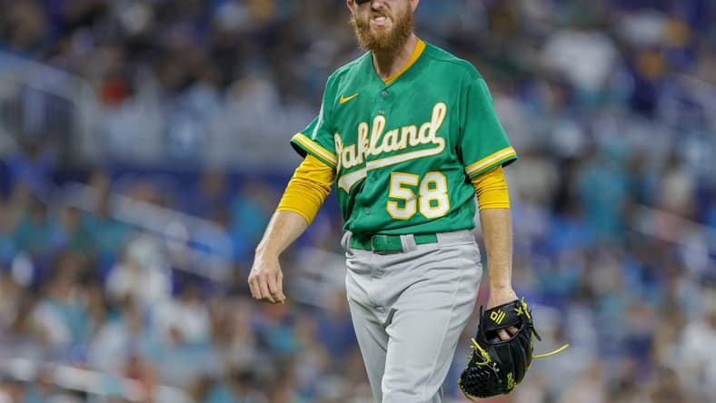 Jun 4, 2023; Miami, Florida, USA; Oakland Athletics starting pitcher Paul Blackburn (58) reacts against the Miami Marlins during the fourth inning at loanDepot Park. Mandatory Credit: Sam Navarro-USA TODAY Sports
