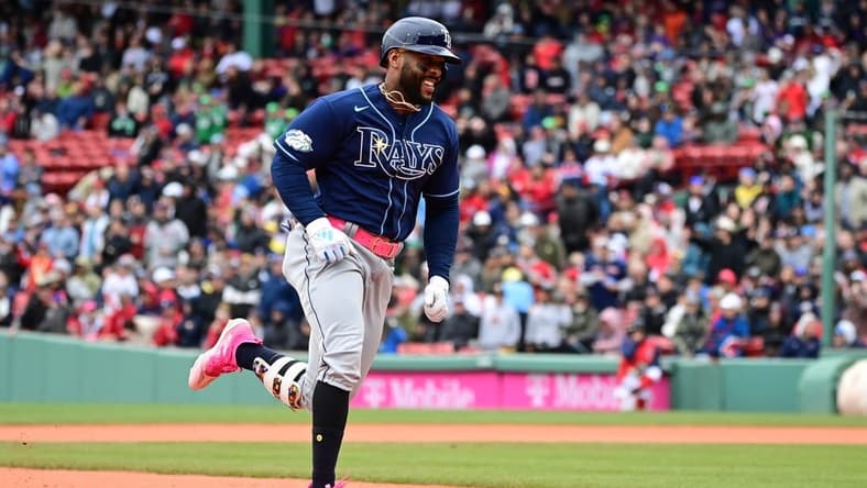 Jun 4, 2023; Boston, Massachusetts, USA; Tampa Bay Rays designated hitter Yandy Diaz (2) scores on his RBI single after a throwing error by the Boston Red Sox during the sixth inning at Fenway Park. Mandatory Credit: Eric Canha-USA TODAY Sports