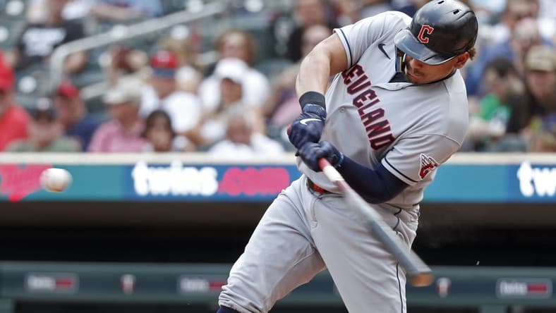 Jun 4, 2023; Minneapolis, Minnesota, USA; Cleveland Guardians designated hitter Josh Naylor (22) hits an RBI double against the Minnesota Twins in the seventh inning at Target Field. Mandatory Credit: Bruce Kluckhohn-USA TODAY Sports