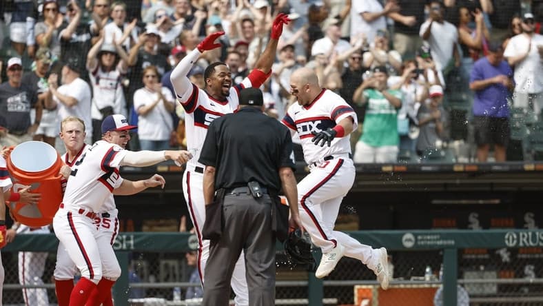 Jun 4, 2023; Chicago, Illinois, USA; Chicago White Sox third baseman Jake Burger (30) celebrates with teammates as he crosses home plate after hitting a grand slam walk-off against the Detroit Tigers during the ninth inning at Guaranteed Rate Field. Mandatory Credit: Kamil Krzaczynski-USA TODAY Sports