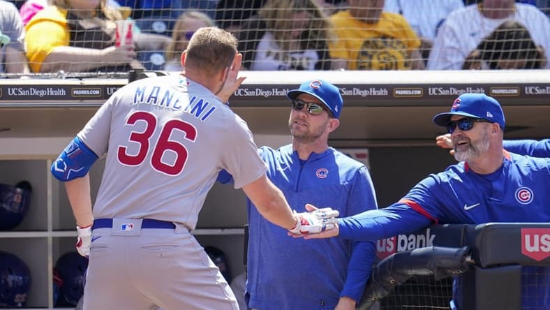 Jun 4, 2023; San Diego, California, USA;  Chicago Cubs first baseman Trey Mancini (36) is congratulated by manager David Ross (3) after hitting a solo home run against the San Diego Padres during the second inning at Petco Park. Mandatory Credit: Ray Acevedo-USA TODAY Sports