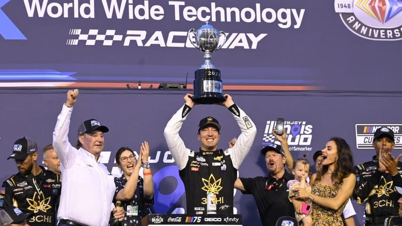 Jun 4, 2023; Madison, Illinois, USA; NASCAR Cup Series driver Kyle Busch (8) and his team pose for a photo after winning the Enjoy Illinois 300 at World Wide Technology Raceway. Mandatory Credit: Joe Puetz-USA TODAY Sports