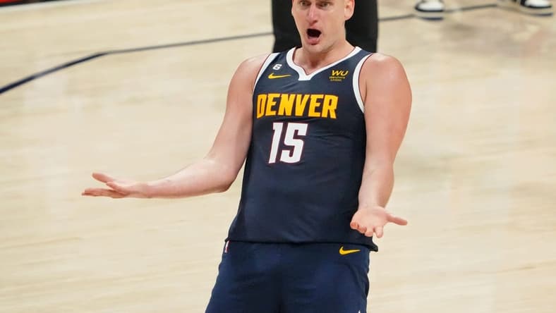 Jun 4, 2023; Denver, CO, USA; Denver Nuggets center Nikola Jokic (15) reacts after a play against the Miami Heat during the third quarter in game two of the 2023 NBA Finals at Ball Arena. Mandatory Credit: Kyle Terada-USA TODAY Sports