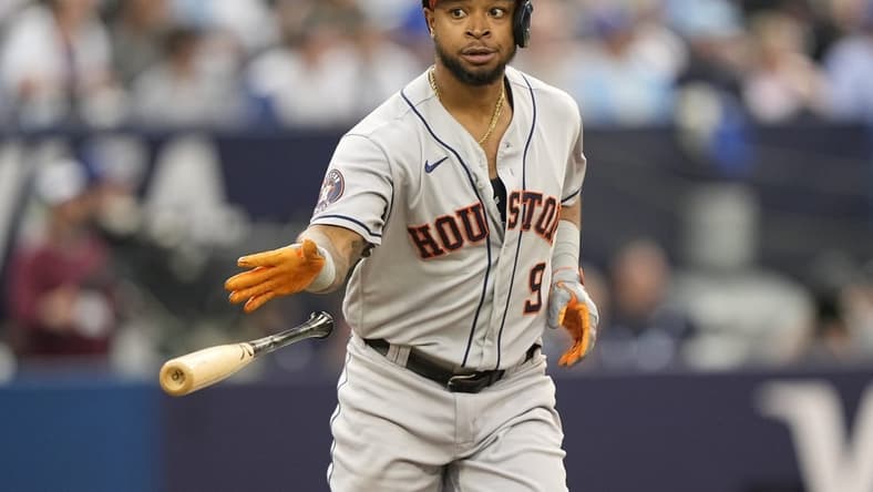 Jun 5, 2023; Toronto, Ontario, CAN; Houston Astros left fielder Corey Julks (9) tosses his bat after hitting a grand slam home run against the Toronto Blue Jays during the first inning at Rogers Centre. Mandatory Credit: John E. Sokolowski-USA TODAY Sports