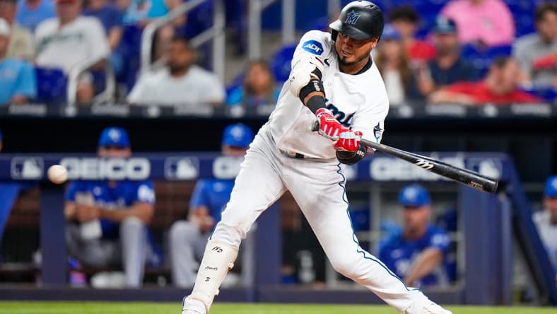 Jun 5, 2023; Miami, Florida, USA; Miami Marlins second baseman Luis Arraez (3) hits a single against the Kansas City Royals during the fourth inning at loanDepot Park. Mandatory Credit: Rich Storry-USA TODAY Sports