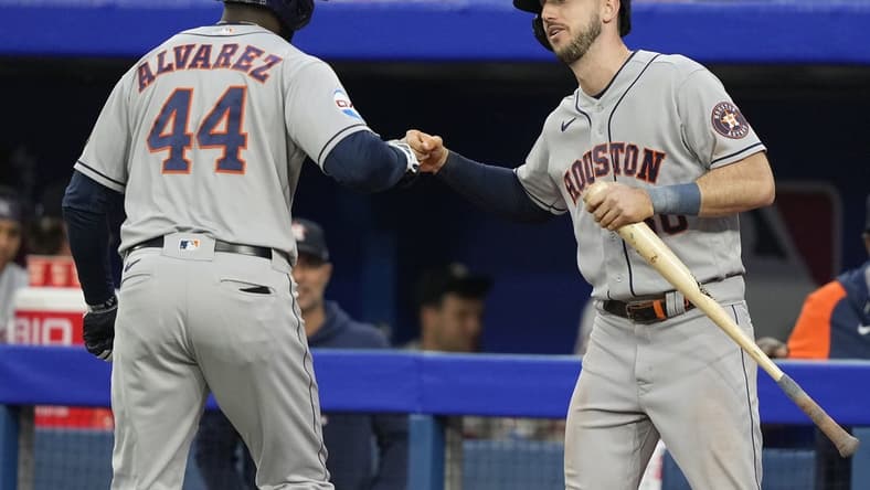Jun 5, 2023; Toronto, Ontario, CAN; Houston Astros right fielder Kyle Tucker (30) congratulates designated hitter Yordan Alvarez (44) on his solo home run against the Toronto Blue Jays during the fourth inning at Rogers Centre. Mandatory Credit: John E. Sokolowski-USA TODAY Sports