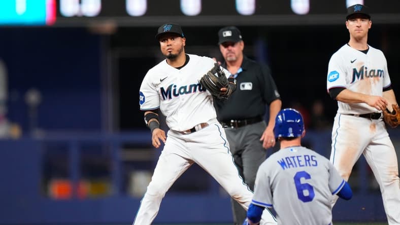 Jun 5, 2023; Miami, Florida, USA; Miami Marlins second baseman Luis Arraez (3) tags out Kansas City Royals center fielder Drew Waters (6) during the ninth inning at loanDepot Park. Mandatory Credit: Rich Storry-USA TODAY Sports