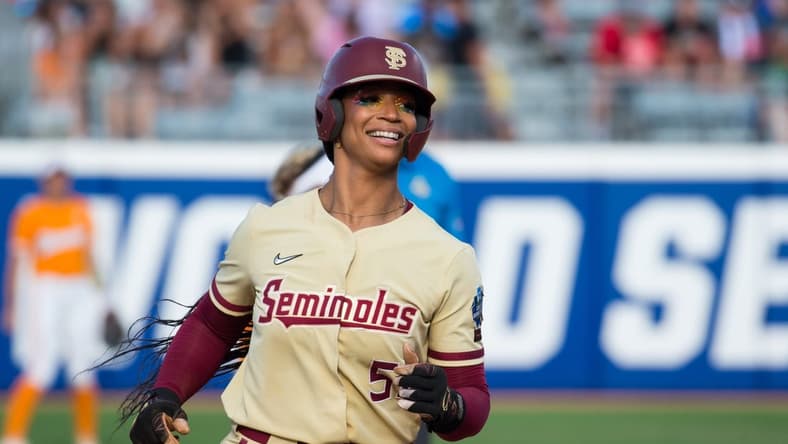 Jun 5, 2023; Oklahoma City, OK, USA; Florida State Seminoles catcher Michaela Edenfield (51) reacts as she rounds the bases after a home run in the second inning against the Tennessee Lady Vols during the semifinal game at OGE Energy Field at the USA Softball Hall of Fame Complex. Mandatory Credit: Brett Rojo-USA TODAY Sports