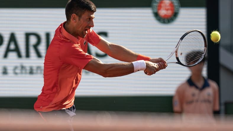 Jun 6 2023; Paris,France; Novak Djokovic (SRB) returns a shot during his match against Karen Khachanov on day 10 at Stade Roland-Garros. Mandatory Credit: Susan Mullane-USA TODAY Sports