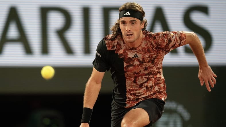 Jun 6 2023; Paris, France; Stefanos Tsitsipas (GRE) runs for the ball during a match against Carlos Alcaraz (ESP) on day 10 at Stade Roland-Garros. Mandatory Credit: Susan Mullane-USA TODAY Sports