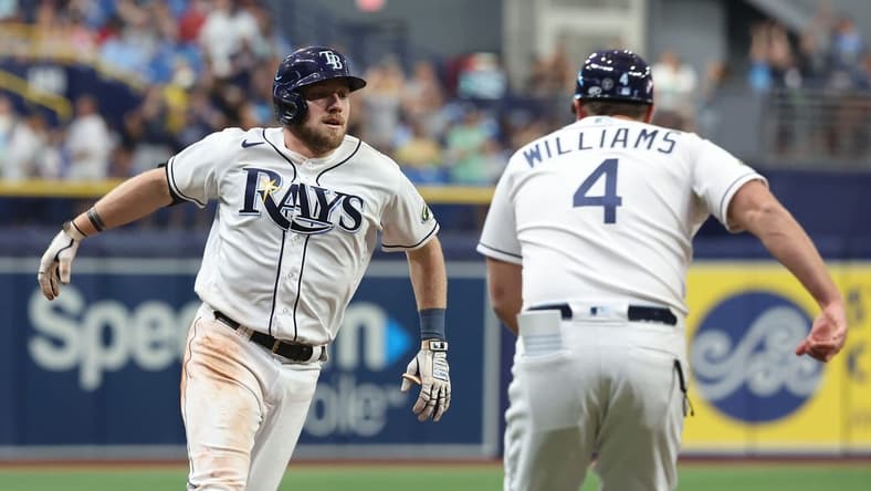 Jun 6, 2023; St. Petersburg, Florida, USA; Tampa Bay Rays right fielder Luke Raley (55) is congratulated by third base coach Brady Williams (4) after he hit a 2-home run against the Minnesota Twins during the fifth inning at Tropicana Field. Mandatory Credit: Kim Klement-USA TODAY Sports