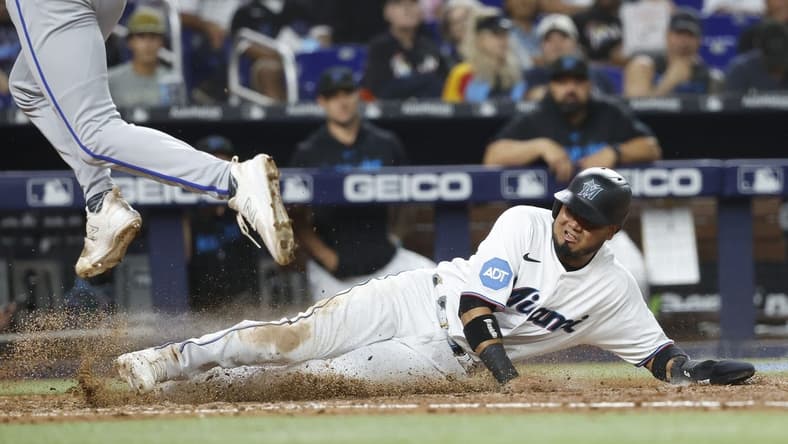 Jun 6, 2023; Miami, Florida, USA; Miami Marlins second baseman Luis Arraez (3) scores on a wild pitch against the Kansas City Royals during the seventh inning at loanDepot Park. Mandatory Credit: Rhona Wise-USA TODAY Sports