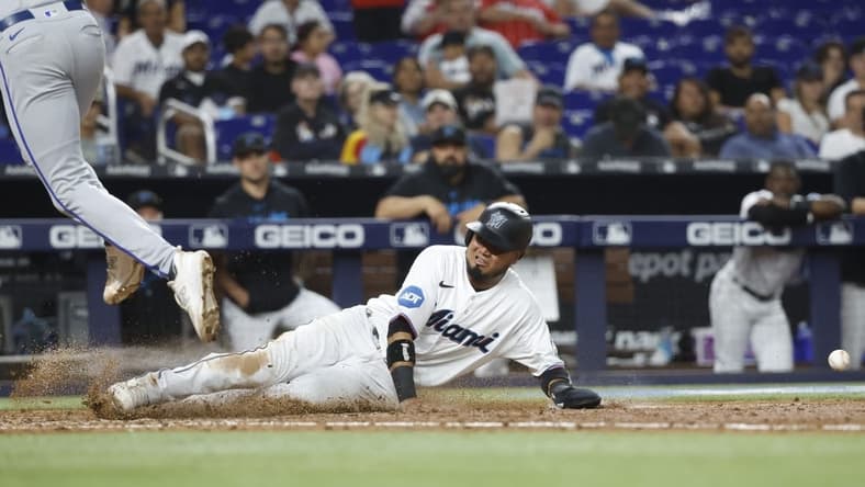 Jun 6, 2023; Miami, Florida, USA; Miami Marlins second baseman Luis Arraez (3) scores on a wild pitch against the Kansas City Royals during the seventh inning at loanDepot Park. Mandatory Credit: Rhona Wise-USA TODAY Sports