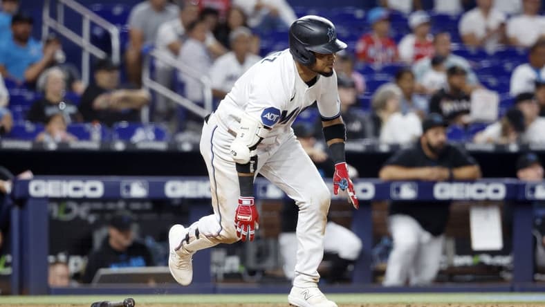 Jun 6, 2023; Miami, Florida, USA; Miami Marlins second baseman Luis Arraez (3) scores on a wild pitch against the Kansas City Royals during the seventh inning at loanDepot Park. Mandatory Credit: Rhona Wise-USA TODAY Sports