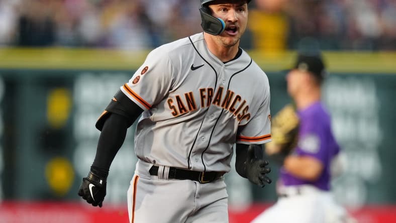 Jun 6, 2023; Denver, Colorado, USA; San Francisco Giants catcher Patrick Bailey (14) runs out a RBI triple in the third inning against the Colorado Rockies at Coors Field. Mandatory Credit: Ron Chenoy-USA TODAY Sports