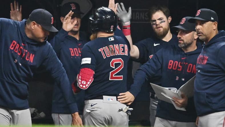 Jun 6, 2023; Cleveland, Ohio, USA; Boston Red Sox designated hitter Justin Turner (2) celebrates after scoring during the eighth inning against the Cleveland Guardians at Progressive Field. Mandatory Credit: Ken Blaze-USA TODAY Sports