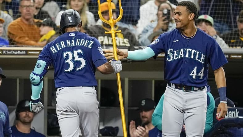 Jun 6, 2023; San Diego, California, USA; Seattle Mariners right fielder Teoscar Hernandez (35) is congratulated by center fielder Julio Rodriguez (44) after hitting a solo home run against the San Diego Padres during the sixth inning at Petco Park. Mandatory Credit: Ray Acevedo-USA TODAY Sports