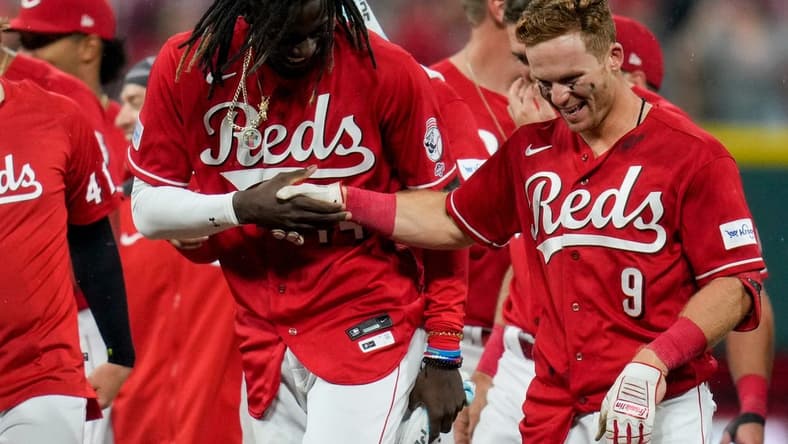Cincinnati Reds third baseman Elly De La Cruz (44) shakes hands with shortstop Matt McLain (9) as the celebrate McLain s walk-off single in the ninth inning of the MLB National League game between the Cincinnati Reds and the LA Dodgers at Great American Ball Park in downtown Cincinnati on Tuesday, June 6, 2023. The Reds won 9-8 on a walk-off, bases loaded, single off the bat of shortstop Matt McLain (9) in the bottom of the ninth.