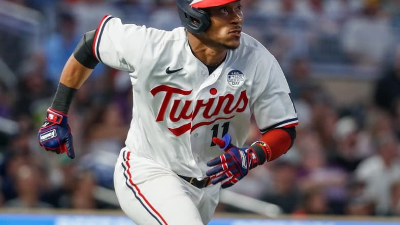 Jun 2, 2023; Minneapolis, Minnesota, USA; Minnesota Twins second baseman Jorge Polanco (11) hits an RBI double against the Cleveland Guardians in the seventh inning at Target Field. Mandatory Credit: Bruce Kluckhohn-USA TODAY Sports