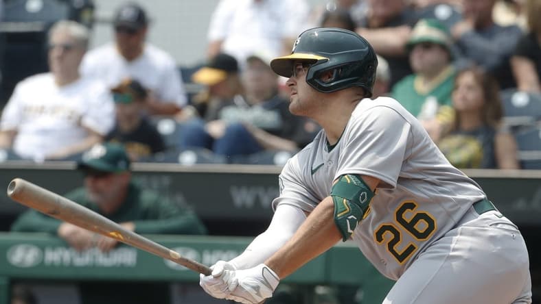 Jun 7, 2023; Pittsburgh, Pennsylvania, USA; Oakland Athletics third baseman Jonah Bride (26) hits an RBI single against the Pittsburgh Pirates during the first inning at PNC Park. Mandatory Credit: Charles LeClaire-USA TODAY Sports