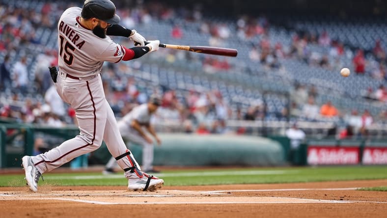 Jun 7, 2023; Washington, District of Columbia, USA; Arizona Diamondbacks third baseman Emmanuel Rivera (15) hits a 2 RBI double against the Washington Nationals during the first inning at Nationals Park. Mandatory Credit: Scott Taetsch-USA TODAY Sports