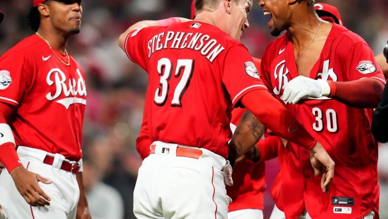 Cincinnati Reds left fielder Will Benson (30) is congratulated at home plate after hitting a walk-off, two-run home run in the ninth inning of a baseball game between the Los Angeles Dodgers and the Cincinnati Reds, Wednesday, June 7, 2023, at Great American Ball Park in Cincinnati.