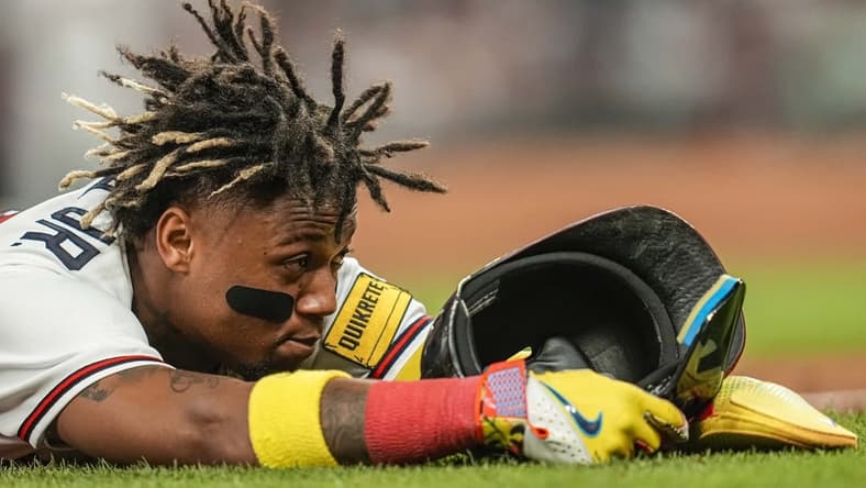 Jun 7, 2023; Cumberland, Georgia, USA; Atlanta Braves right fielder Ronald Acuna Jr. (13) shown after stealing third base against the New York Mets during the eighth inning at Truist Park. Mandatory Credit: Dale Zanine-USA TODAY Sports