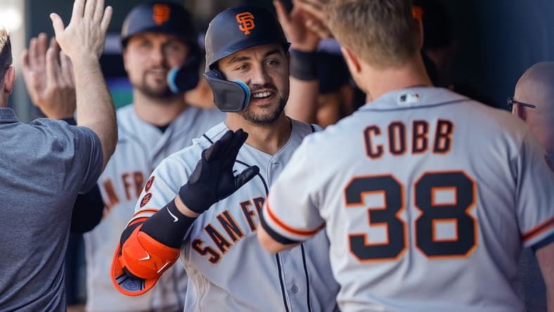 Jun 8, 2023; Denver, Colorado, USA; San Francisco Giants right fielder Michael Conforto (8) celebrates in the dugout on a two run home run in the sixth inning against the Colorado Rockies at Coors Field. Mandatory Credit: Isaiah J. Downing-USA TODAY Sports