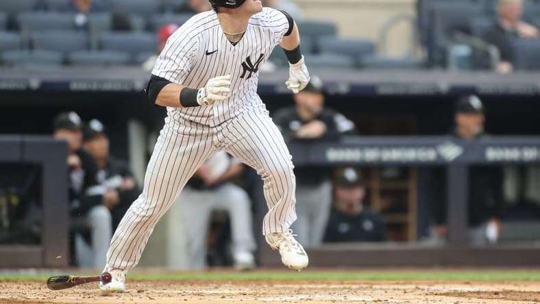 Jun 8, 2023; Bronx, New York, USA; New York Yankees center fielder Billy McKinney (57) hits a triple in the second inning against the Chicago White Sox at Yankee Stadium. Mandatory Credit: Wendell Cruz-USA TODAY Sports