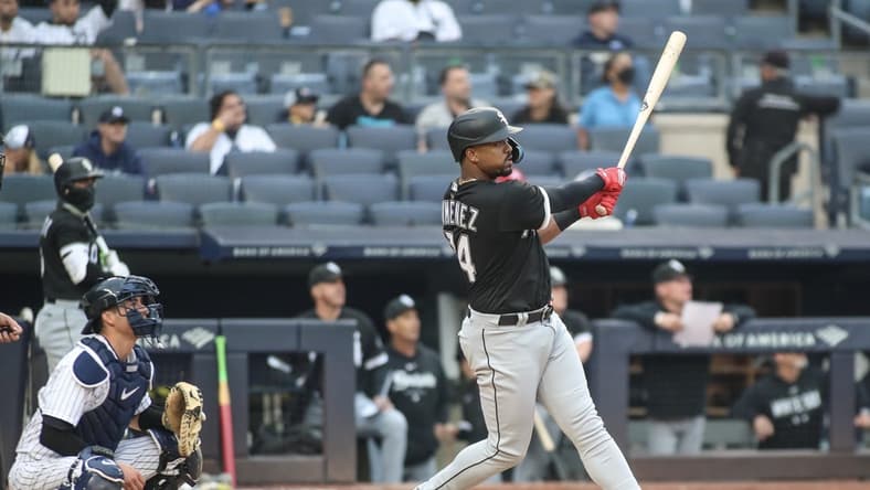 Jun 8, 2023; Bronx, New York, USA; Chicago White Sox right fielder Eloy Jimenez (74) hits a two run home run in the seventh inning against the New York Yankees at Yankee Stadium. Mandatory Credit: Wendell Cruz-USA TODAY Sports