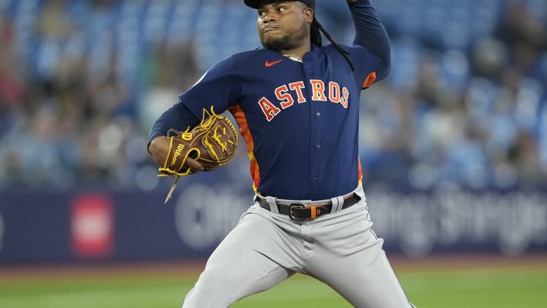 Jun 8, 2023; Toronto, Ontario, CAN; Houston Astros starting pitcher Framber Valdez (59) pitches to the Toronto Blue Jays during the fifth inning at Rogers Centre. Mandatory Credit: John E. Sokolowski-USA TODAY Sports