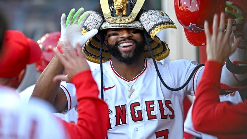 Jun 8, 2023; Anaheim, California, USA; Los Angeles Angels right fielder Jo Adell (7) is congratulated in the dugout after hitting a solo home run in the second inning against the Chicago Cubs at Angel Stadium. Mandatory Credit: Jayne Kamin-Oncea-USA TODAY Sports