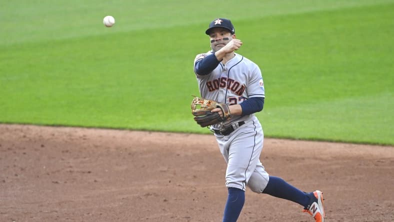 Jun 9, 2023; Cleveland, Ohio, USA; Houston Astros second baseman Jose Altuve (27) throws to first base in the third inning against the Cleveland Guardians at Progressive Field. Mandatory Credit: David Richard-USA TODAY Sports