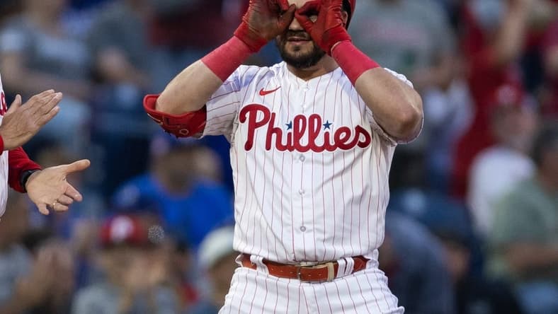 Jun 9, 2023; Philadelphia, Pennsylvania, USA; Philadelphia Phillies left fielder Kyle Schwarber (12) reacts after hitting a triple during the third inning against the Los Angeles Dodgers at Citizens Bank Park. Mandatory Credit: Bill Streicher-USA TODAY Sports