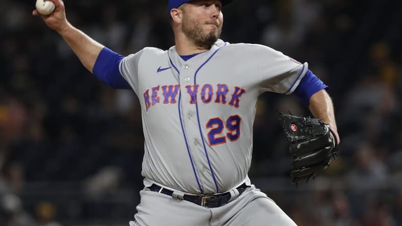 Jun 9, 2023; Pittsburgh, Pennsylvania, USA; New York Mets relief pitcher Tommy Hunter (29) pitches against the Pittsburgh Pirates during the seventh inning at PNC Park. Mandatory Credit: Charles LeClaire-USA TODAY Sports